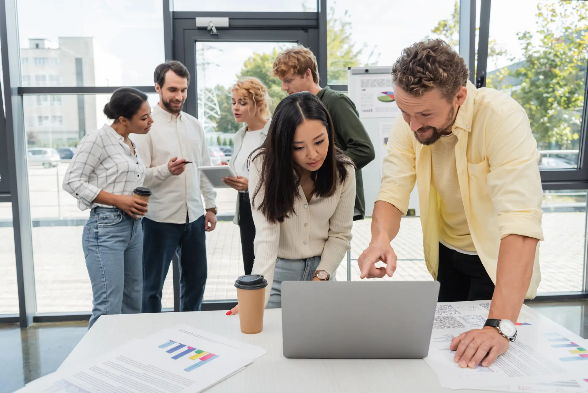 Marketing team reviewing business analytics and digital growth strategy